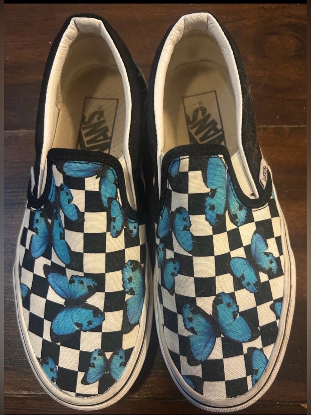 Vans Black & White Checkerboard Slip-On Sneakers with Blue Butterflies